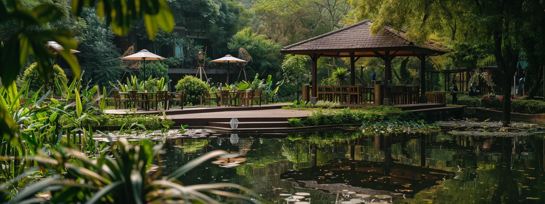 a tranquil lakeside retreat venue with spacious meeting areas and team-building activities set against a backdrop of lush greenery.